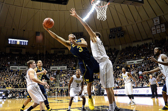 Jordan Morgan (52) and Trey Burke (3)
