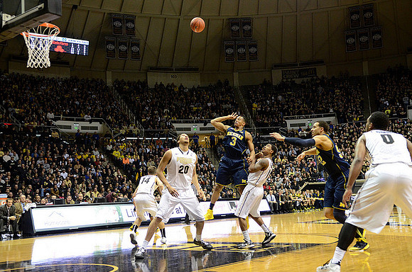 Trey Burke (3) and Jordan Morgan (52)