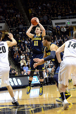 Nik Stauskas (11) and Jordan Morgan (52)