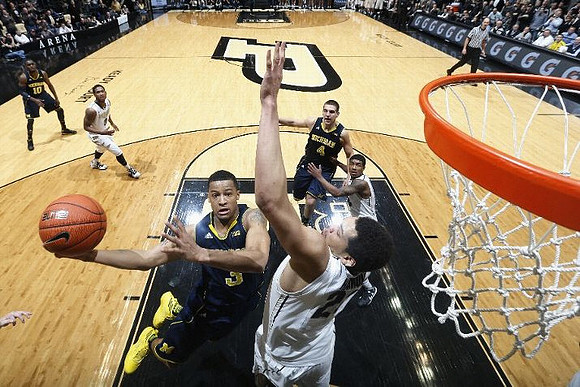 Trey Burke (3), Mitch McGary (4), and Tim Hardaway Jr. (10)