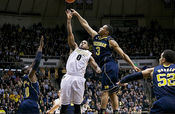 Tim Hardaway Jr. (10), Trey Burke (3), and Jordan Morgan (52)