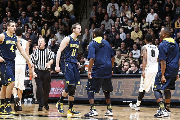 Mitch McGary (4), Nik Stauskas (11), Corey Person (32), and Eso Akunne (5)