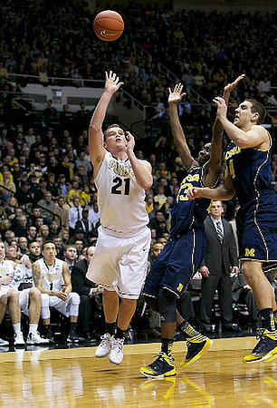 Caris LeVert (23) and Mitch McGary (4)