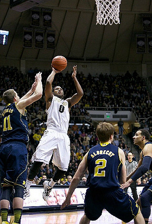 Nik Stauskas (11), Spike Albrecht (2), and Jordan Morgan (52)