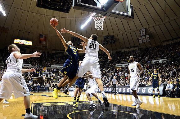 Trey Burke (3), Max Bielfeldt (44), and Nik Stauskas (11)