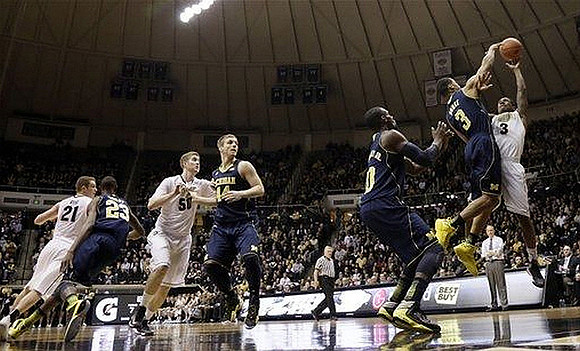 Caris LeVert (23), Max Bielfeldt (44), Tim Hardaway Jr. (10), and Trey Burke (3)