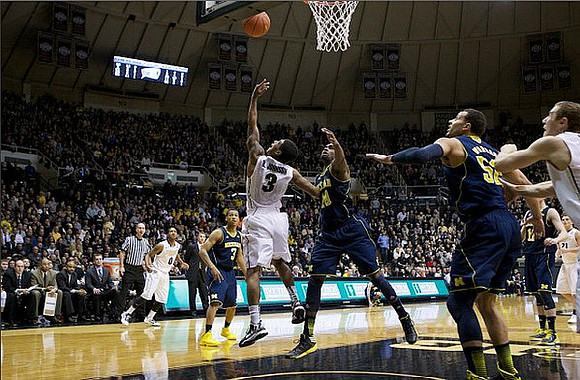 Trey Burke (3), Tim Hardaway Jr. (10), Jordan Morgan (52), and Nik Stauskas (11)