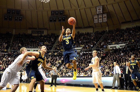Mitch McGary (4), Trey Burke (3), and Glenn Robinson III (1)