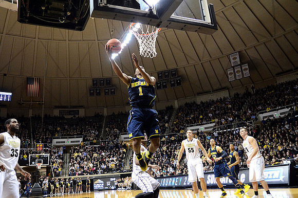 Glenn Robinson III (1), Jordan Morgan (52), and Trey Burke (3)