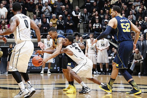 Trey Burke (3) and Jordan Morgan (52)