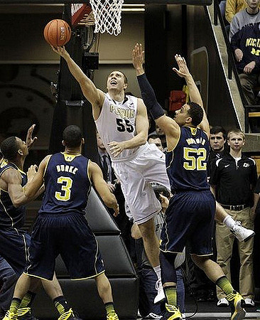 Glenn Robinson III (1), Trey Burke (3), and Jordan Morgan (52)