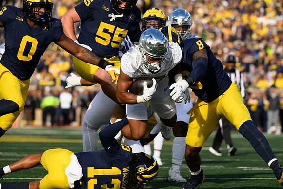Josaiah Stewart (0), Mason Graham (55), Wesley Walker (13), and Derrick Moore (8)