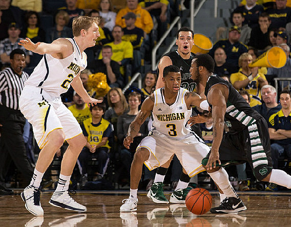 Blake McLimans (22) and Trey Burke (3)