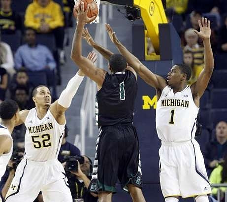 Jordan Morgan (52) and Glenn Robinson III (1)