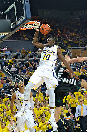 Jordan Morgan (52), Tim Hardaway Jr. (10), and John Beilein