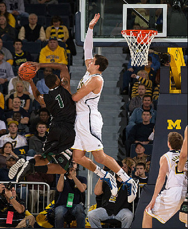 Mitch McGary (4) and Spike Albrecht (2)