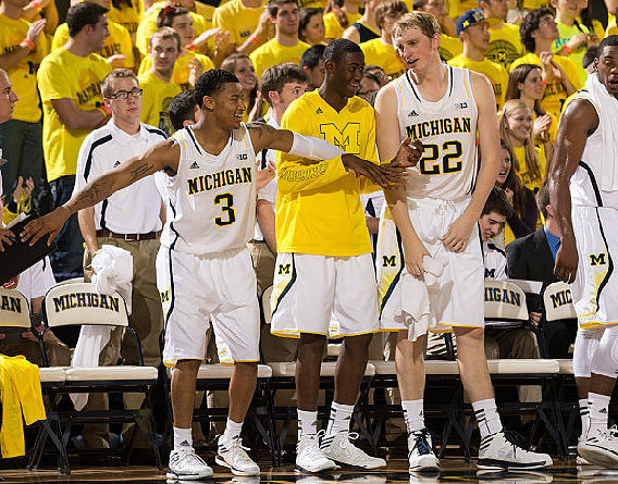 Trey Burke (3), Caris LeVert (23), and Blake McLimans (22)