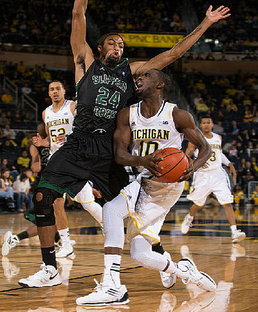 Jordan Morgan (52), Tim Hardaway Jr. (10), and Trey Burke (3)
