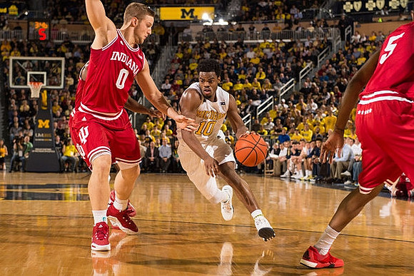 Derrick Walton Jr. (10) and Aubrey Dawkins (24)