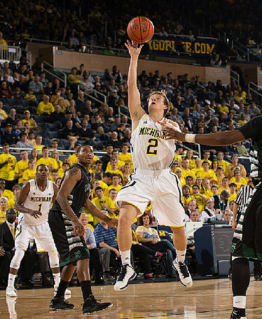 Glenn Robinson III (1) and Spike Albrecht (2)