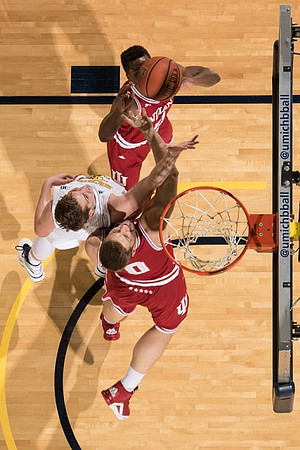 Mark Donnal (34) and Derrick Walton Jr. (10)