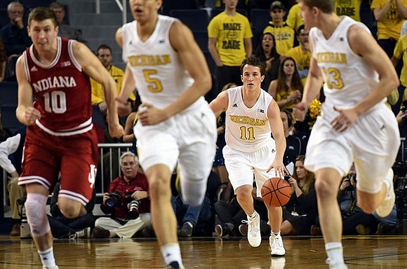 D.J. Wilson (5), Andrew Dakich (11), and Moritz Wagner (13)