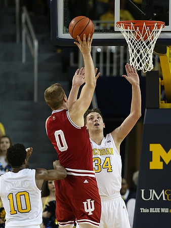 Derrick Walton Jr. (10) and Mark Donnal (34)