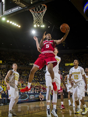 Duncan Robinson (22), Mark Donnal (34), and Muhammad-Ali Abdur-Rahkman (12)