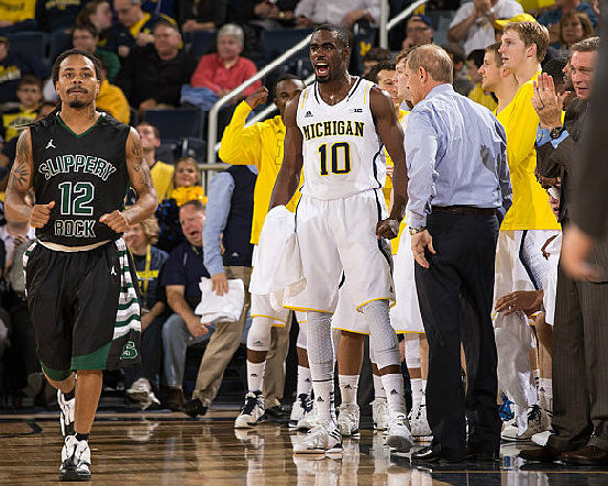 Tim Hardaway Jr. (10), John Beilein, and Jeff Meyer