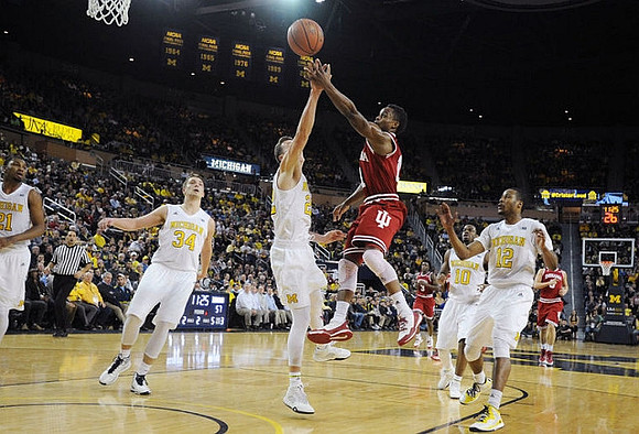 Zak Irvin (21), Mark Donnal (34), Duncan Robinson (22), Derrick Walton Jr. (10), and Muhammad-Ali Abdur-Rahkman (12)