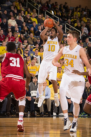 Mark Donnal (34), Muhammad-Ali Abdur-Rahkman (12), Zak Irvin (21), and Derrick Walton Jr. (10)