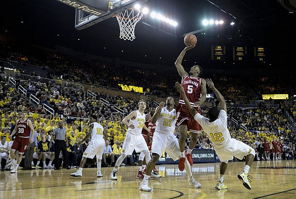 Derrick Walton Jr. (10), Mark Donnal (34), Zak Irvin (21), and Muhammad-Ali Abdur-Rahkman (12)