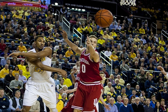 Derrick Walton Jr. (10) and Former Michigan Player Max Bielfeldt