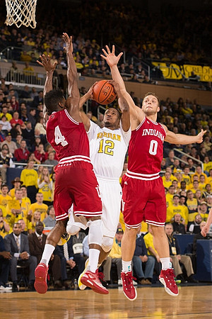 Derrick Walton Jr. (10) and Aubrey Dawkins (24)