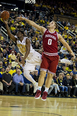 Derrick Walton Jr. (10) and Former Michigan Player Max Bielfeldt