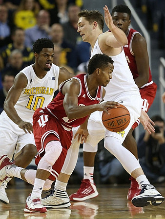 Derrick Walton Jr. (10) and Mark Donnal (34)