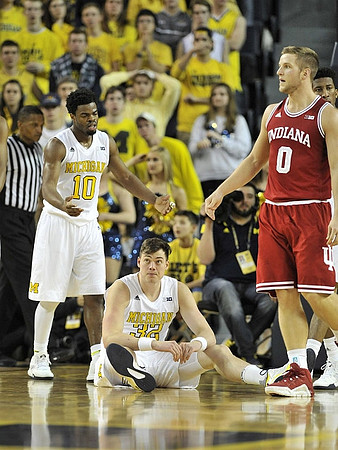 Derrick Walton Jr. (10), Ricky Doyle (32), and Former Michigan Player Max Bielfeldt