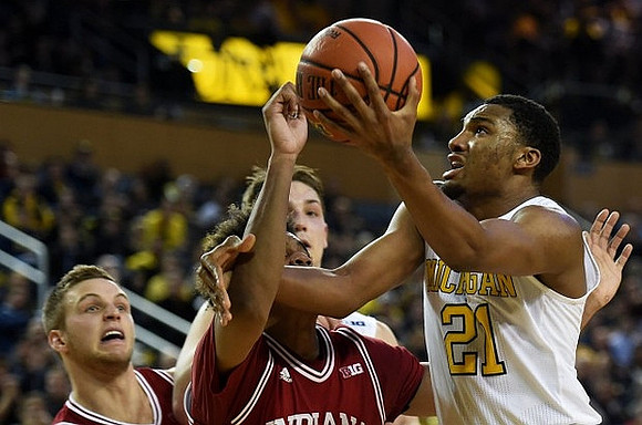 Former Michigan Player Max Bielfeldt and Zak Irvin (21)
