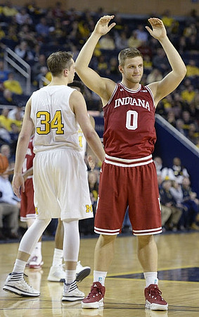 Mark Donnal (34) and Former Michigan Player Max Bielfeldt