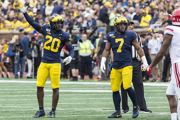 Brad Hawkins (20) and Khaleke Hudson (7)
