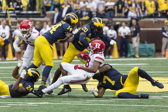 Lavert Hill (24), Josh Metellus (14), Brad Hawkins (20), and Khaleke Hudson (7)