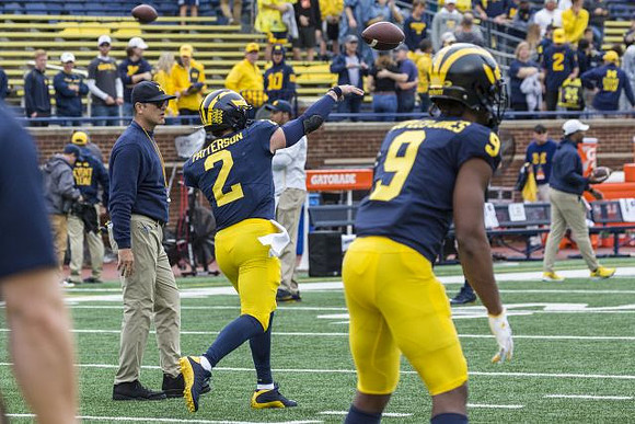 Jim Harbaugh, Shea Patterson (2), and Donovan Peoples-Jones (9)