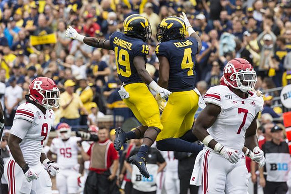 Mike Sainristil (19) and Nico Collins (4)