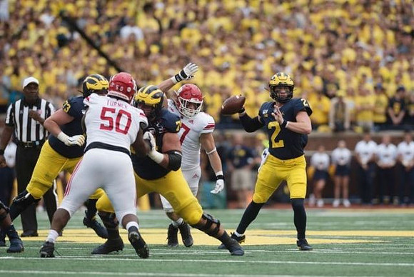 Jalen Mayfield (73), Ben Bredeson (74), and Shea Patterson (2)