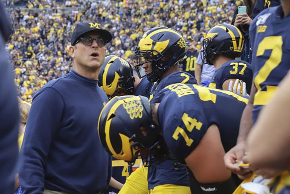 Jim Harbaugh, Ben Bredeson (74), Khaleke Hudson (7), Dane Drobocky (37), and Carlo Kemp (2)