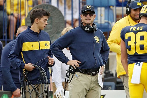 Jim Harbaugh, Joseph Files (38), and Grant Newsome