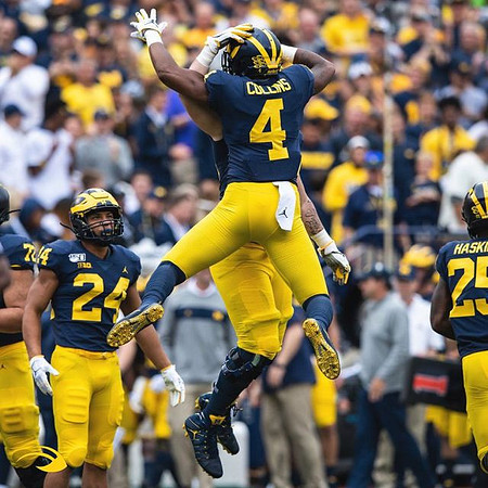 Stephen Spanellis (72), Zach Charbonnet (24), Nico Collins (4), and Hassan Haskins (25)
