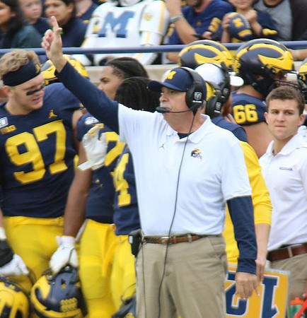 Aidan Hutchinson (97), Carlo Kemp (2), and Don Brown