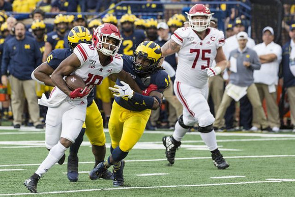 Josh Uche (6) and Josh Metellus (14)
