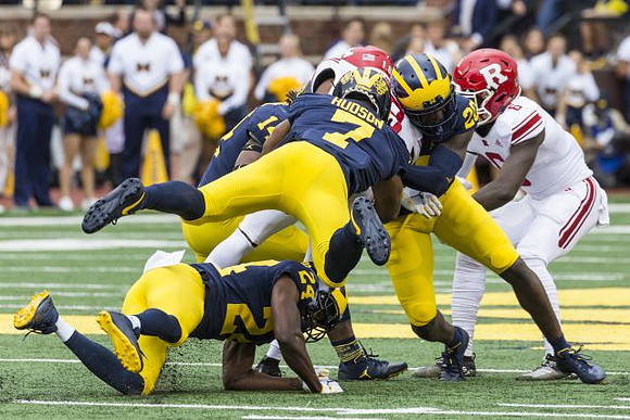 Lavert Hill (24), Josh Metellus (14), Khaleke Hudson (7), and Brad Hawkins (20)